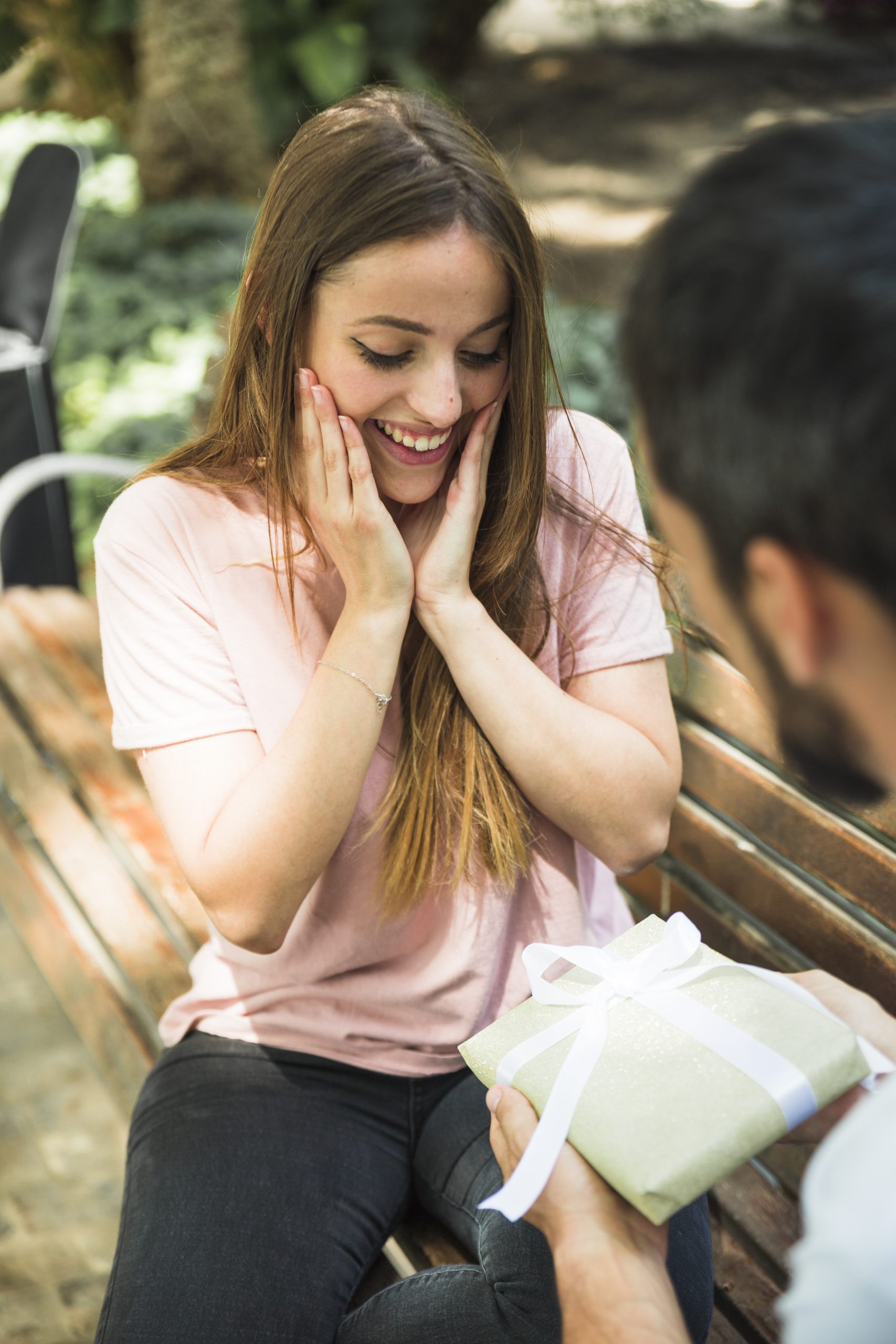 amazed woman looking valentine gift bought by her boyfriend (1)